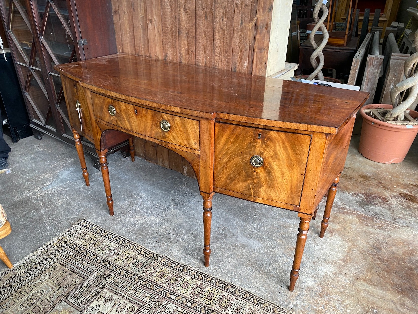 A Regency mahogany bowfront sideboard, length 184cm, depth 75cm, height 93cm